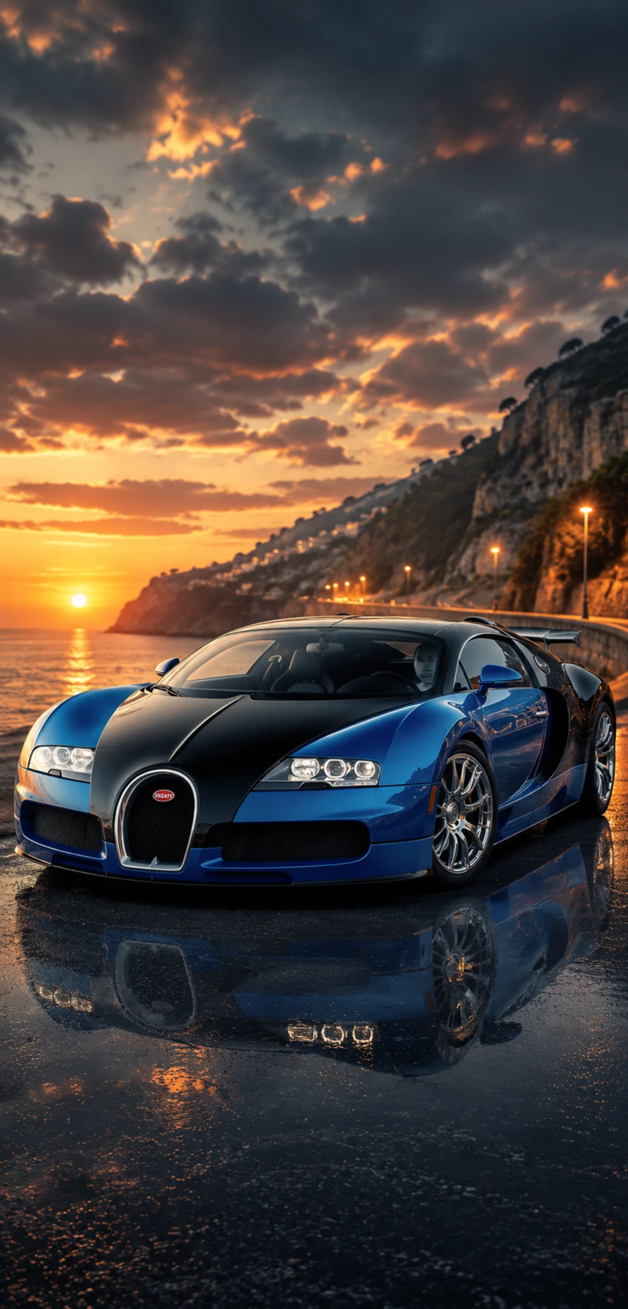 Blau-schwarzer Bugatti Veyron an Steilküste bei Sonnenuntergang mit Meerblick